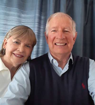 Margaret and Gregory Baker smile as they take a selfie together.