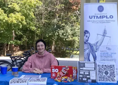 Miriam sitting at a table outdoors