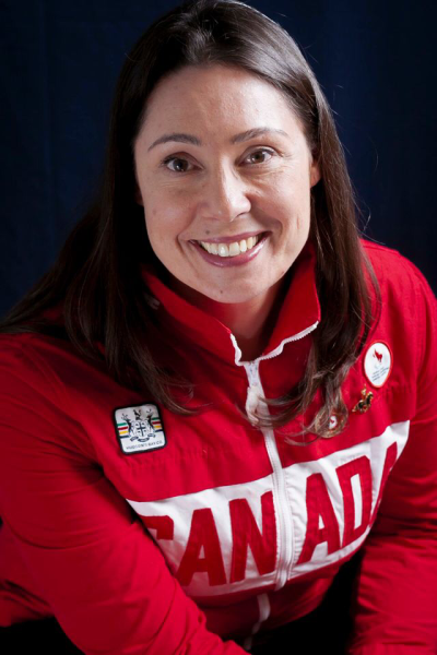 Victoria Nolan: a young white woman smiling and wearing a team canada sweatshirt.