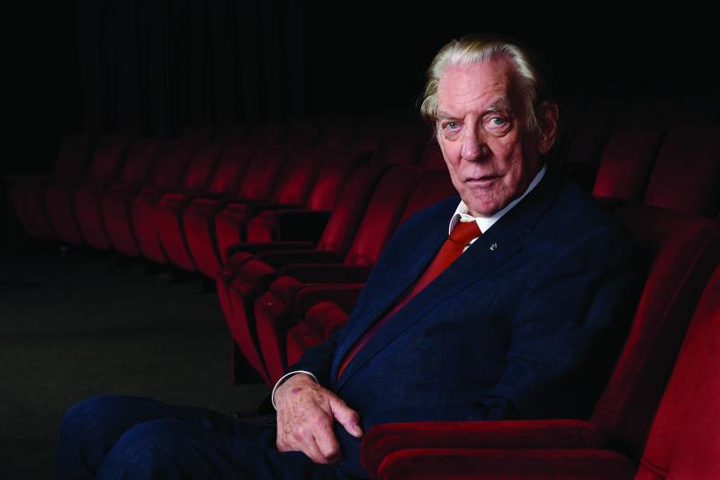 A man sitting in a cinema seat