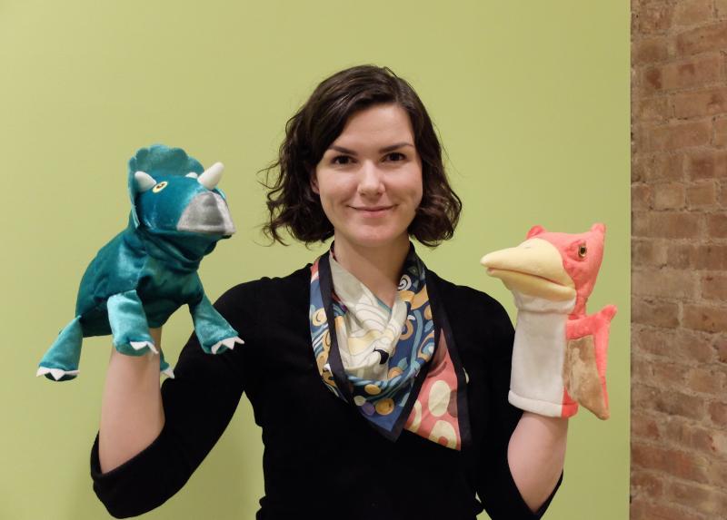 Linguist Ailís Cournane, who specialized in children's language acquisition, holds props from the Child Language Lab that she leads at New York University (photo by Sheng-Fu Wang)