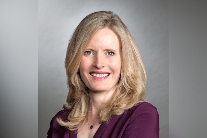 Portrait photo of Claire Kennedy smiling.