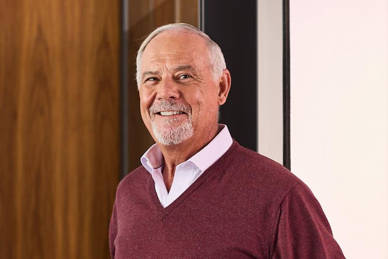 Portrait image of John Cassaday smiling.