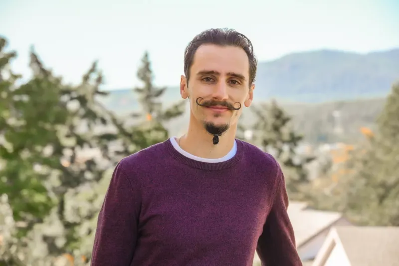 Portrait of Ariel Fabbro in front of a nature scene