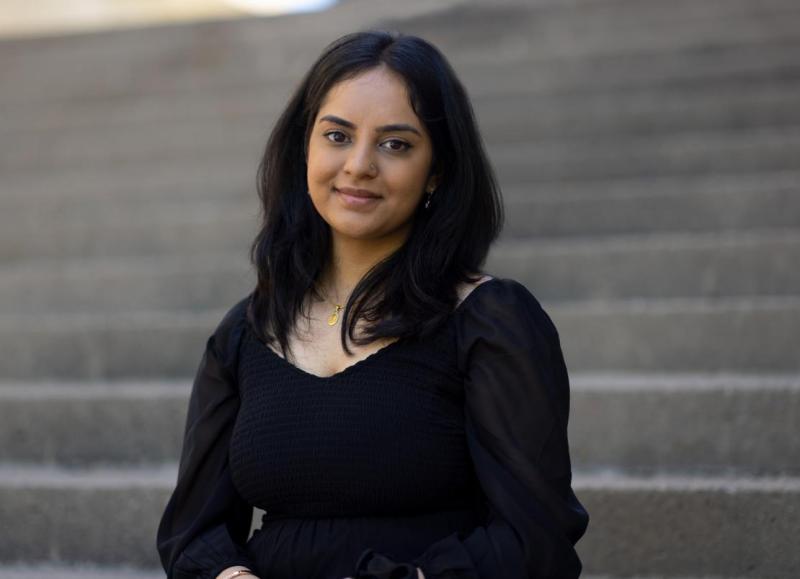Bhanvi Sachdeva standing in front of steps