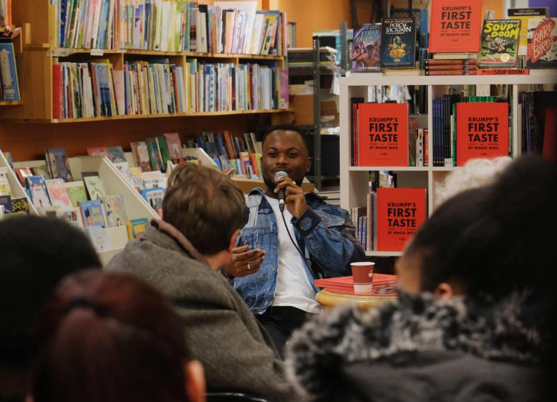 Michael speaking at a book event
