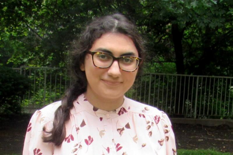 Fatima Azahraa Al Saadie smiles while standing in a park outdoors.