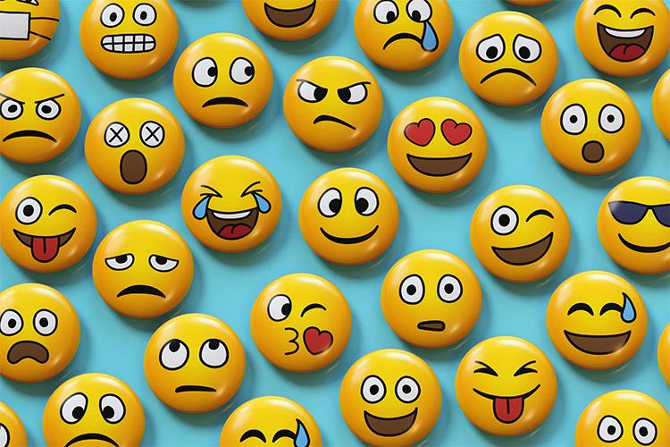 An array of emojis show faces smiling, frowning, winking, sweating, angry, with hearts for eyes, etc.