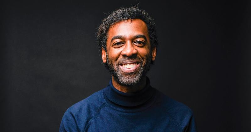 Photo of Ian Williams smiling happily.