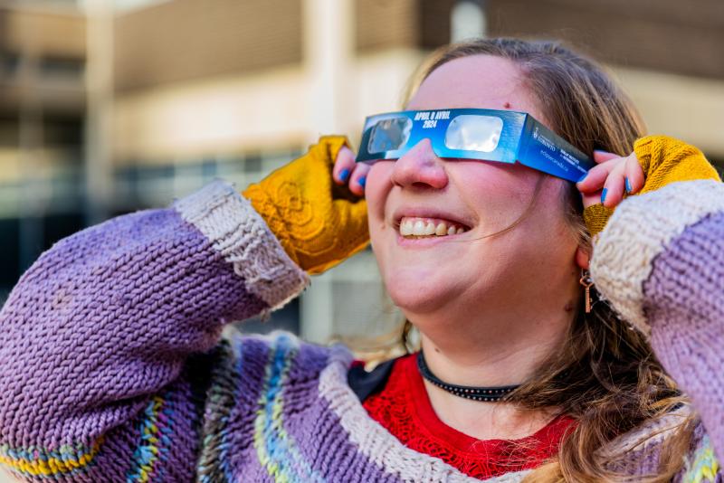 Ilana wearing solar eclipse glasses
