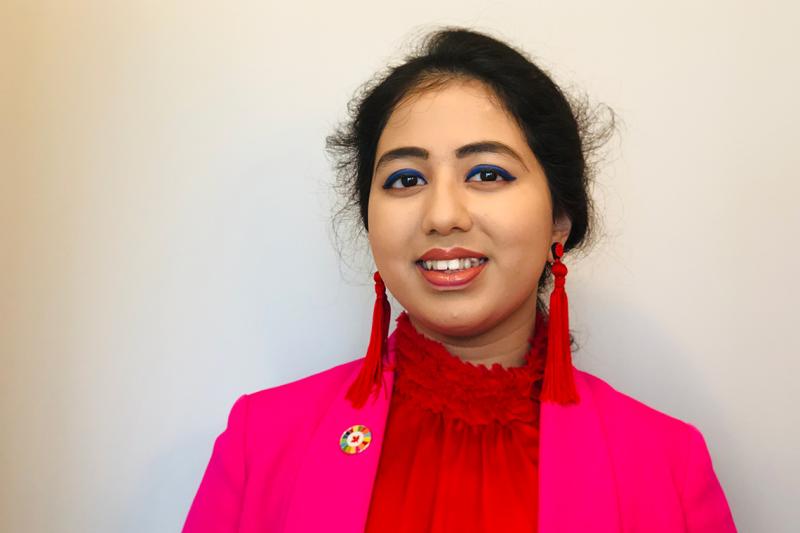 Portrait photo of Kehkashan Basu smiling.