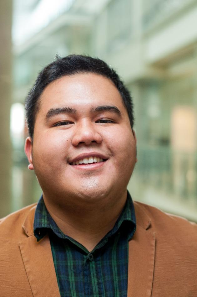A portrait of LJ smiling