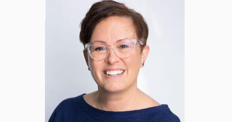 Leigh Chapman smiling.