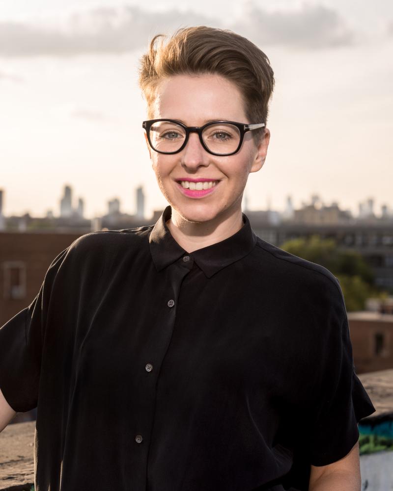 An image of Martine August outdoors smiling.