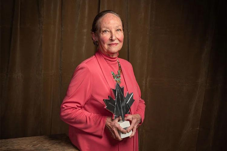 Rosalie Abella holding an award