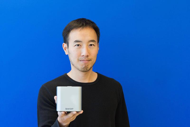 Paul Lem holds out his test kit, a small silver box.