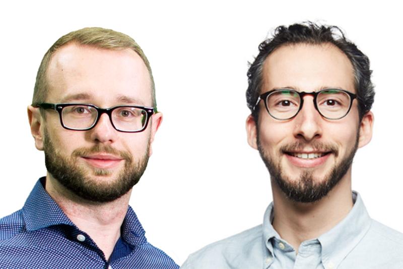 Pawel Buczkowicz and Orion Buske stand side by side and smile.