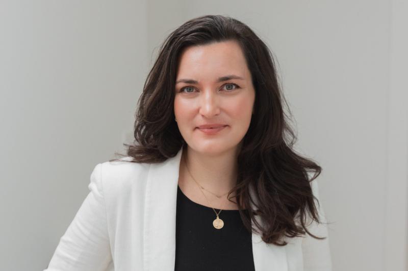 Portrait of Tieghan wearing a white blazer and black shirt
