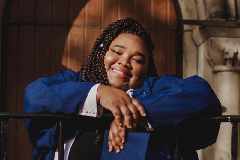Carisse Samuel in her graduation robes, smiling
