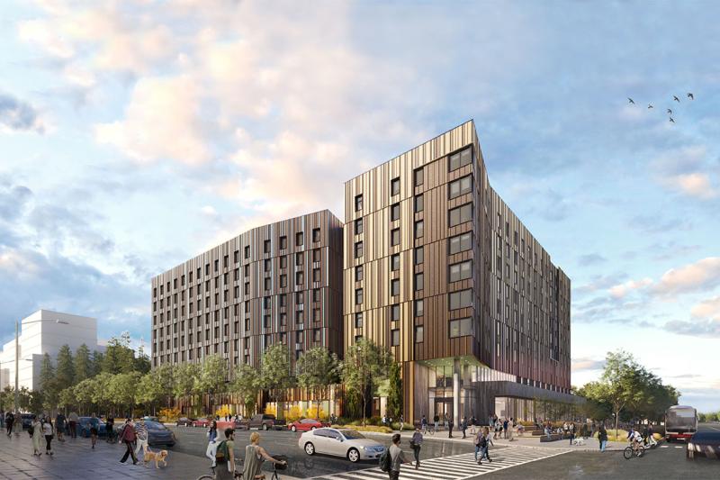 An artist's drawing of the future U of T Scarborough residence shows two large buildings with curved walls and sharp corners.