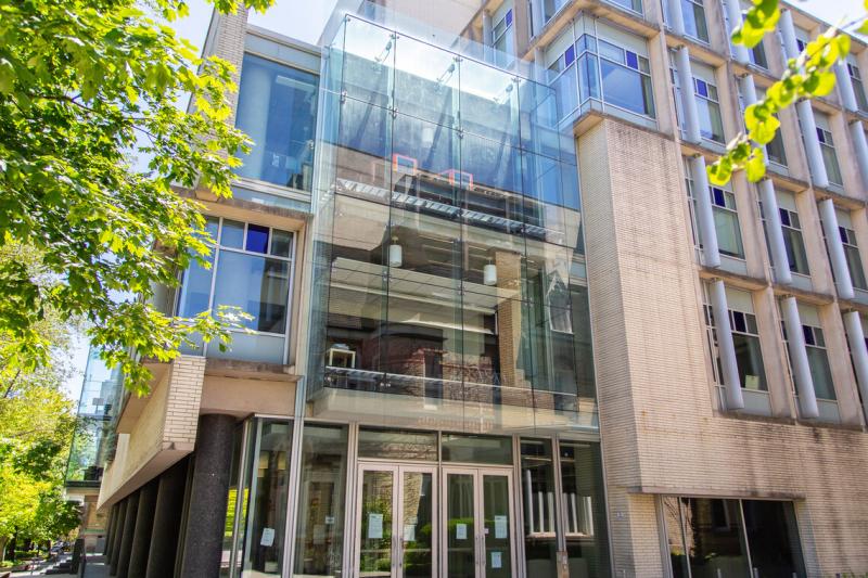 The exterior of the Bahen Centre, a brick building with one glass wall, and home of the department of computer science.