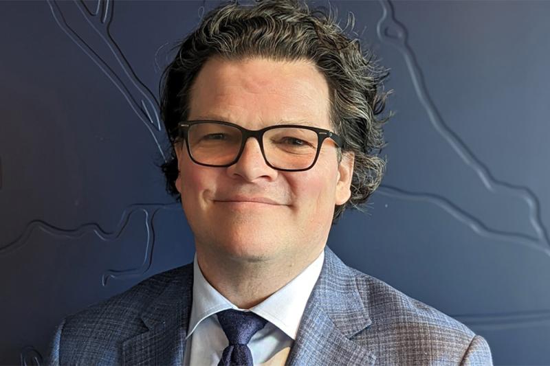 Portrait of Colin McKay smiling.
