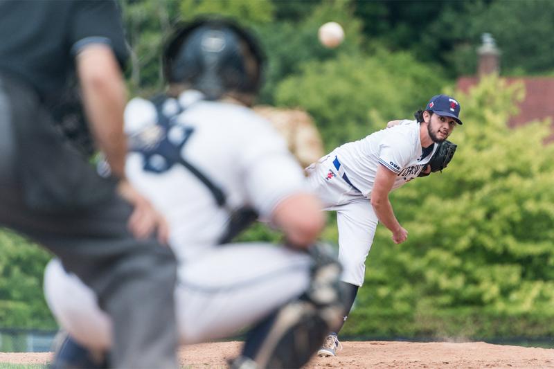 Conall Helverson pitches a baseball directly at a waiting catcher.