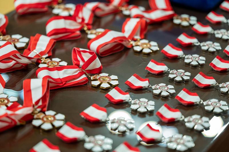 Order of Canada medals laying flat on a table