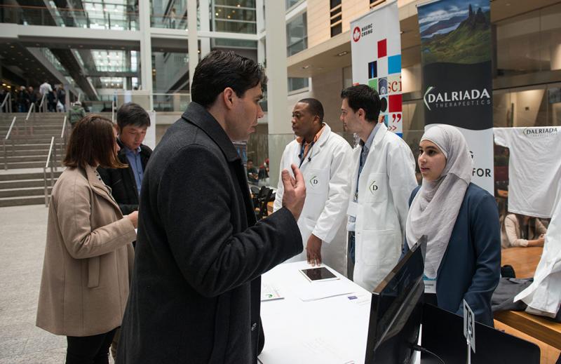 Representatives from Dalriada Therapeutics, a startup launched at the University of Toronto Mississauga, talk to visitors during U of T's Startup Showcase at MaRS on March 1 (photo by Laura Pedersen)