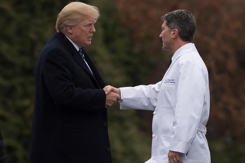 U.S. President Donald Trump shakes hands with White House Physician Rear Admiral Dr. Ronny Jackson following his annual physical in January (SAUL LOEB/AFP/Getty Images) 