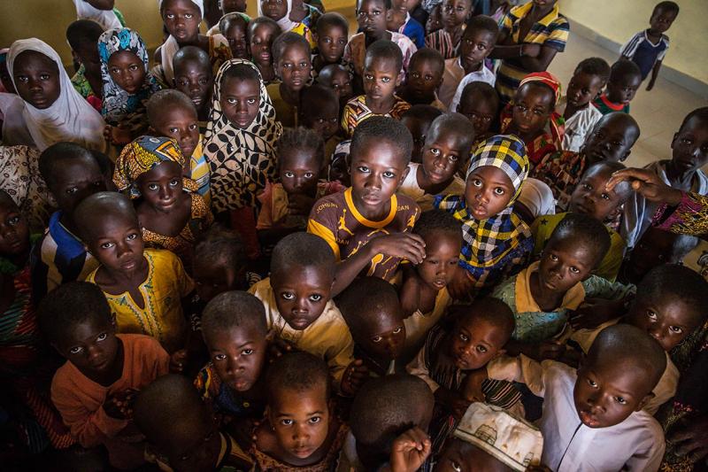 A group of children in their classroom in the village of Kpalong, 50 kilometres outside Tamale in northern Ghana (photo by Marcus Valance/SOPA Images/LightRocket via Getty Images) 