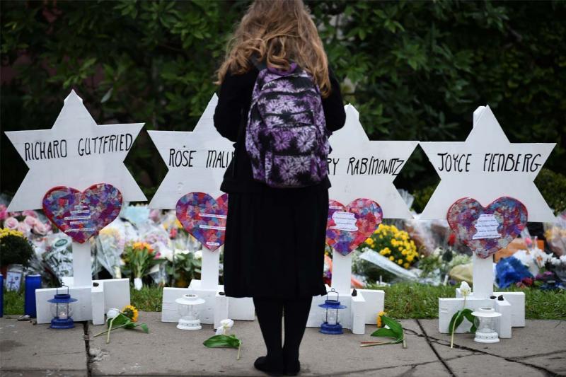 A makeshift memorial located outside of the Tree of Life synagogue in Pittsburgh includes the name Joyce Fienberg, who was a U of T alumna (photo by Brendan Smialowski/ AFP/Getty Images) 