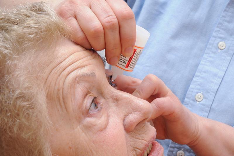A nurse in France administers an anti-glaucoma agent to a patient (photo by BSIP/UIG via Getty Images)