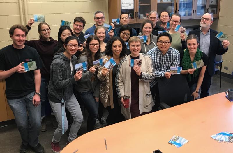 Members of the Jonathan Abbatt and Scott Mabury labs with their signed U of T postcards to #SupportTheReport. The labs answered the @ShoichetLab postcard-signing challenge (photo by Angelika Duffy/The Shoichet Lab)