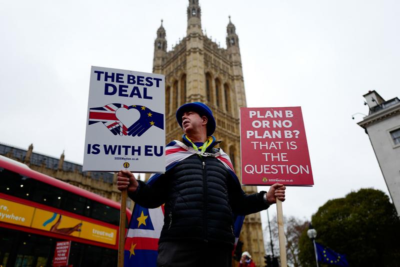 Anti-Brexit activist Steve Bray stands holding placards outside the Houses of Parliament in central London on Jan. 16 (photo by Tolga Akmen/AFP via Getty Images)