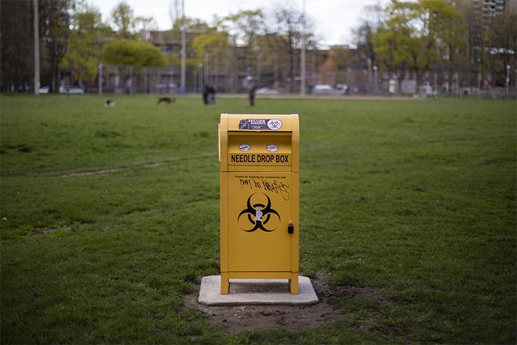 The needle drop box in Moss Park is a sturdy metal box with a mailbox-like drop tray.