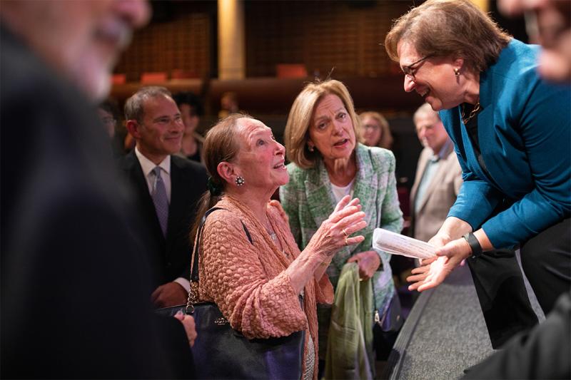 Rosalie Abella and Elena Kagan smiling and chatting together.