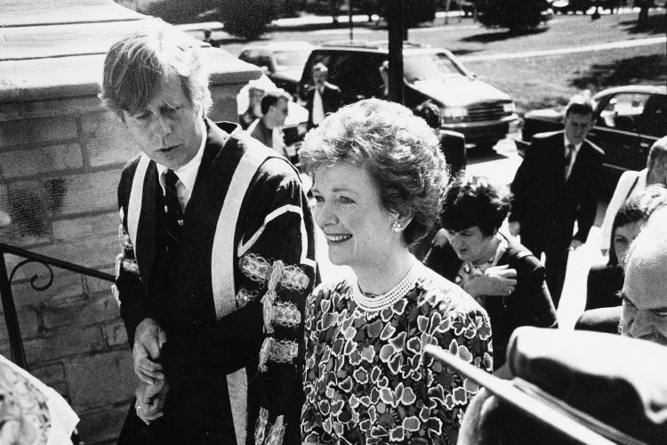 Mary Robinson smiles as she walks from Front Campus into Croft Chapter House with U of T President Robert Prichard.