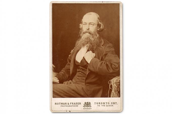 Photo of Henry Holmes Croft in Victorian three-piece-suit, with long hair and beard.