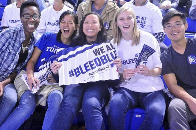 Cheering students wearing "Bleed Blue" T-shirts. (photo by Ken Jones)
