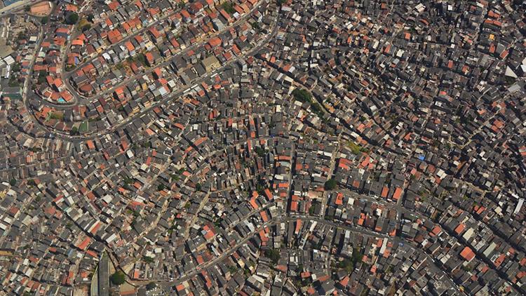 Dense housing in a city seen from the air (photo courtesy of the Reach Project)