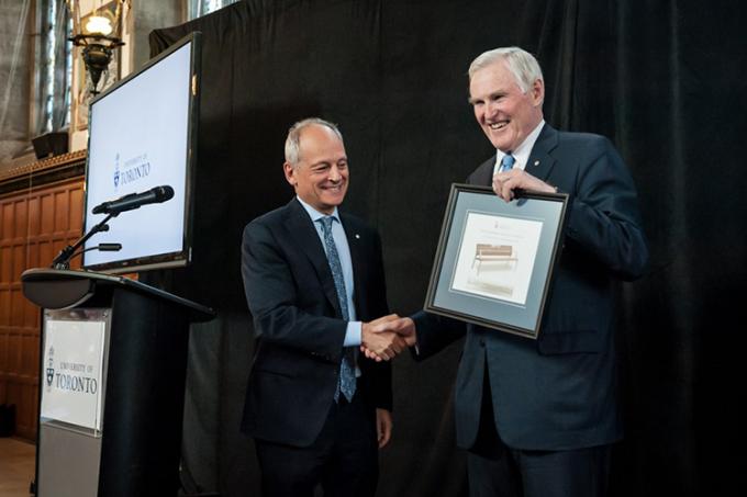 U of T President Meric Gertler makes a presentation to Wilson (photo by Lisa Sakulensky)