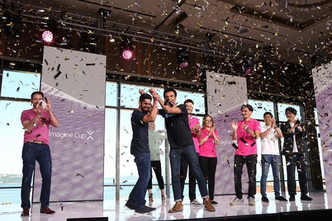 Samin Khan (U of T) and Hamayal Choudhry (UOIT) celebrate their smartARM win on the Imagine Cup World Finals stage (photo courtesy of Microsoft Imagine Cup)
