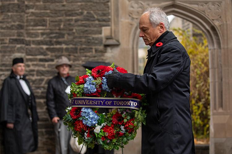 U of T President Meric Gertler lays a wreath at the foot of Soldiers' Tower (photo by Nick Iwanyshyn)