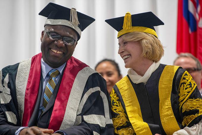 Wisdom Tettey shares a laugh with U of T Chancellor Rose Patten during the installation (photo by Alexa Battler)