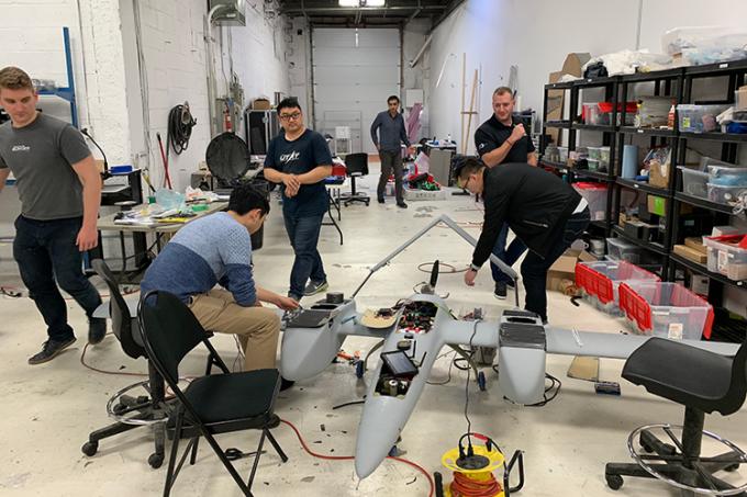 The Sky Guys team building the drone in their workshop (photo courtesy the Sky Guys)