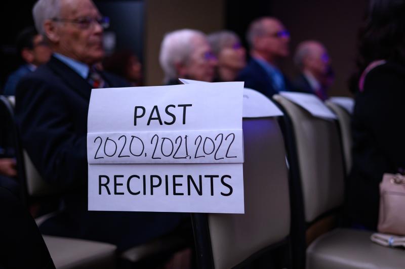 A sign shows that the ceremony is also honoring recipients from 2020, 2021 and 2022.