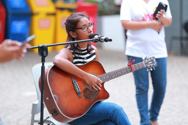Rashmi de Silva Wijeyeratne playing the guitar