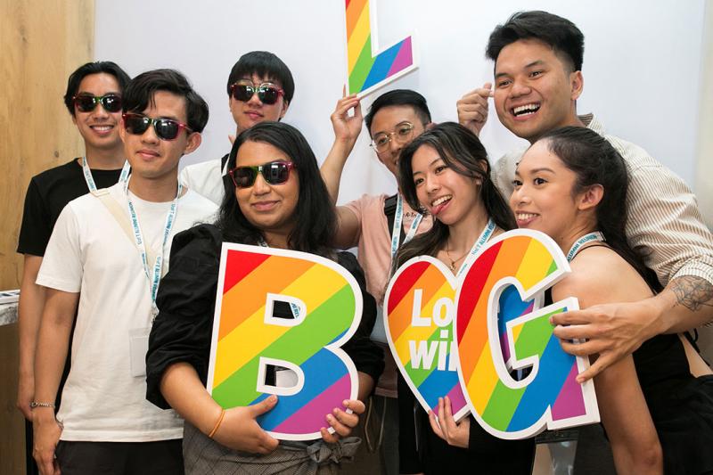 Photo of Alumni together at phot booth at the 2SLGBTQ+ spring soiree.
