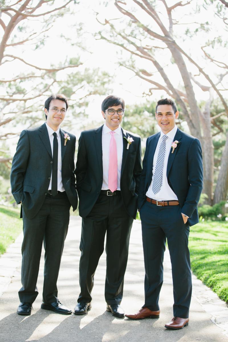 Three men standing outside